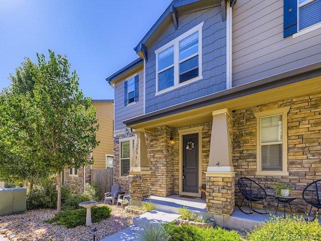 15269 W 69th Cir Unit A, Arvada, CO 80007 - view of front of property featuring stone siding and covered porch