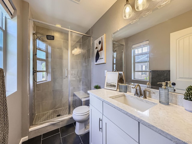 15269 W 69th Cir Unit A, Arvada, CO 80007 - full bath with tile patterned floors, vanity, and a stall shower