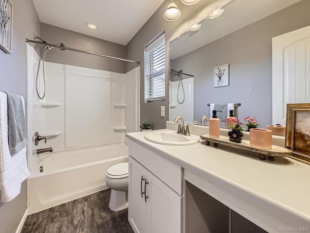 15269 W 69th Cir Unit A, Arvada, CO 80007 - bathroom with vanity, wood finished floors, and tub / shower combination