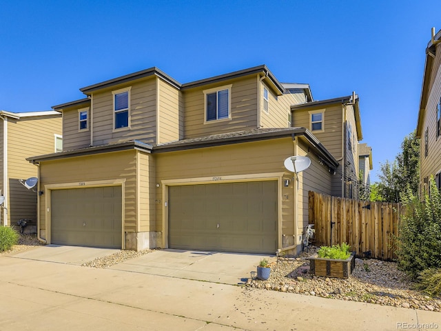 15269 W 69th Cir Unit A, Arvada, CO 80007 - traditional home featuring a garage and driveway