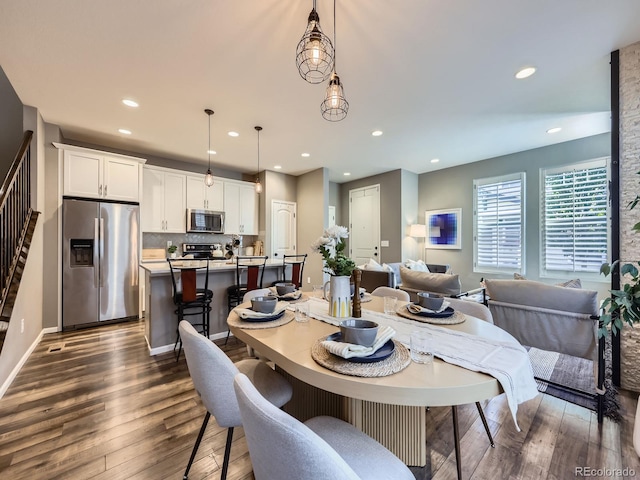 15269 W 69th Cir Unit A, Arvada, CO 80007 - dining space featuring dark wood-style floors, recessed lighting, and stairs