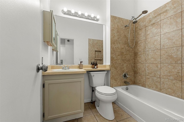 full bathroom featuring tile patterned floors, toilet, vanity, and tiled shower / bath