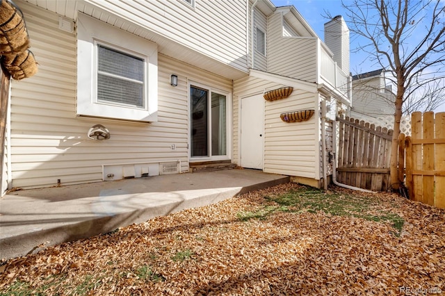 entrance to property featuring a patio area