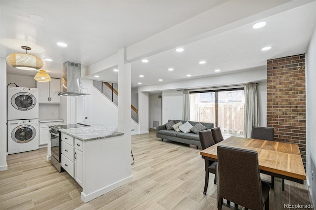 7995 E Mississippi Ave Unit A4, Denver, CO 80247 - dining room with stacked washer / drying machine, stairway, baseboards, light wood-style floors, and recessed lighting