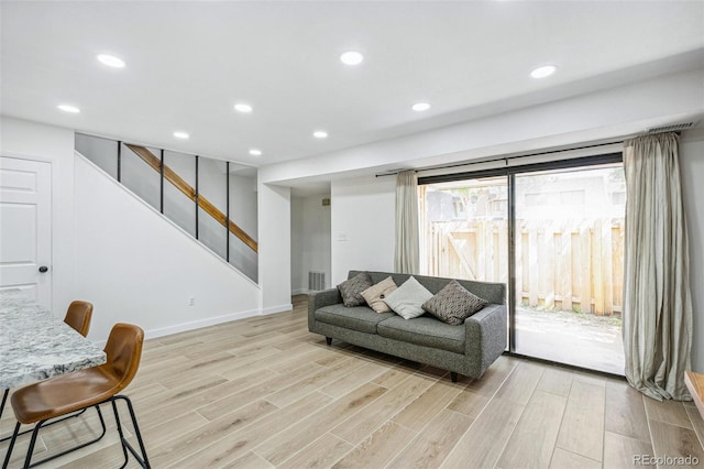 7995 E Mississippi Ave Unit A4, Denver, CO 80247 - living area featuring light wood-style floors, stairway, baseboards, and recessed lighting