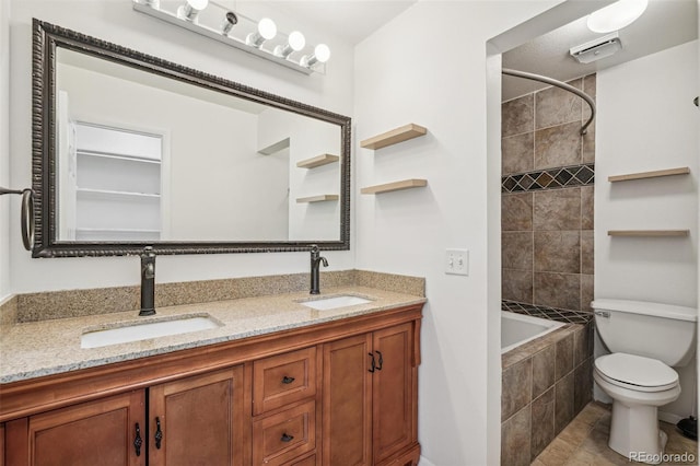 7995 E Mississippi Ave Unit A4, Denver, CO 80247 - bathroom featuring double vanity, tiled shower / bath, toilet, and tile patterned floors