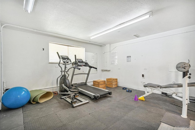 7995 E Mississippi Ave Unit A4, Denver, CO 80247 - exercise room featuring a textured ceiling