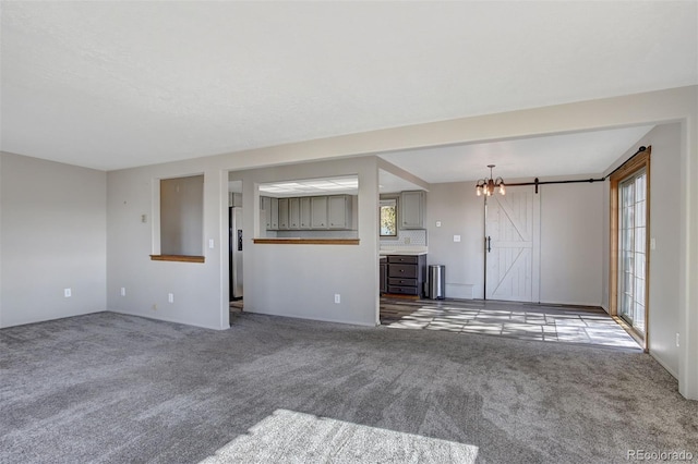 255 Park View Dr, Fairplay, CO 80440 - unfurnished living room with an inviting chandelier and carpet
