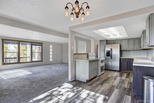 255 Park View Dr, Fairplay, CO 80440 - kitchen featuring a sink, gray cabinets, double oven range, and stainless steel fridge with ice dispenser