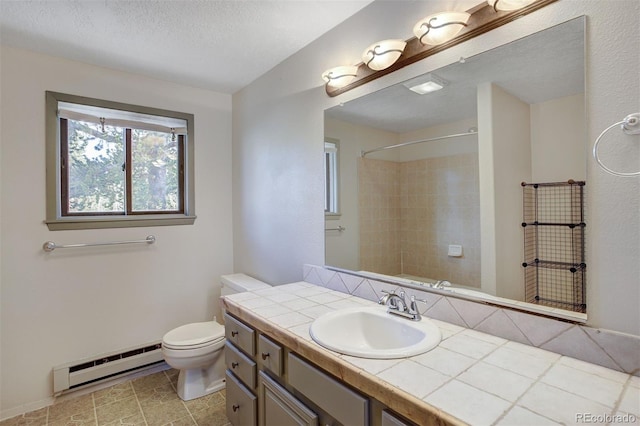 255 Park View Dr, Fairplay, CO 80440 - full bath with walk in shower, tile patterned flooring, vanity, toilet, and a baseboard radiator