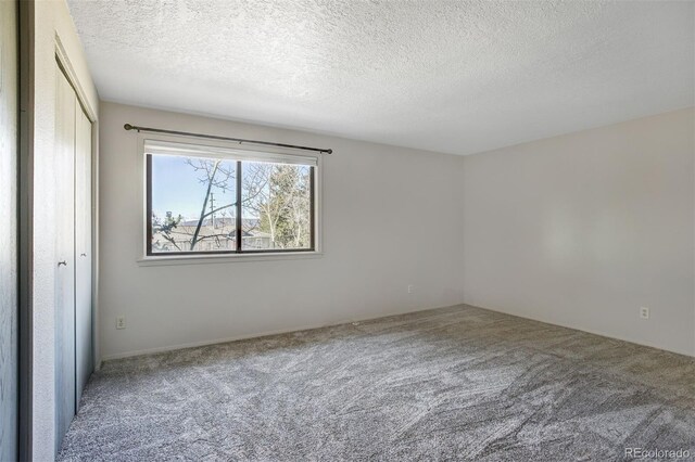 255 Park View Dr, Fairplay, CO 80440 - unfurnished bedroom with a closet, carpet flooring, and a textured ceiling