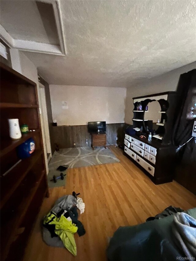 1900 Quebec St, Denver, CO 80220 - living area featuring a textured ceiling and wood finished floors