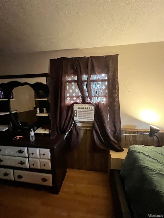 1900 Quebec St, Denver, CO 80220 - bedroom featuring a textured ceiling, wood finished floors, and cooling unit
