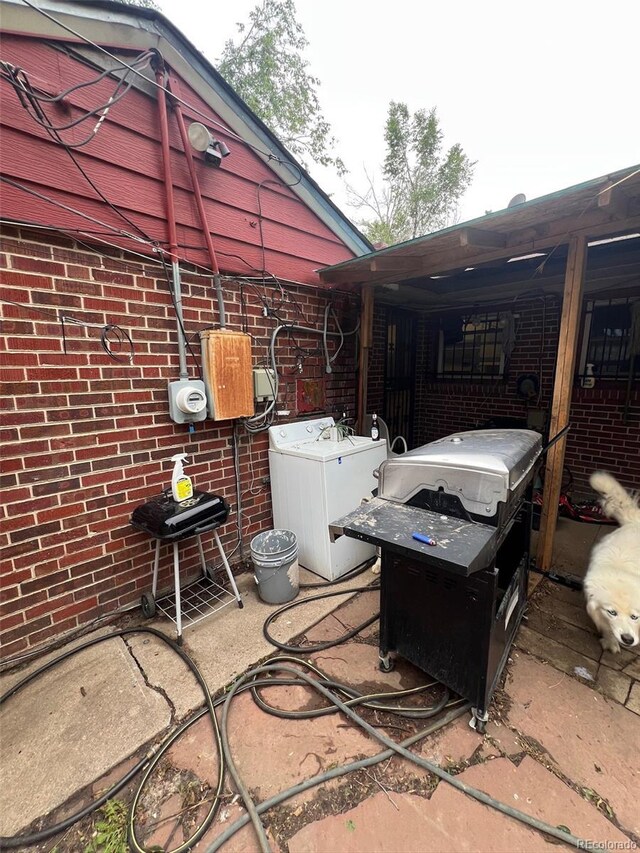 1900 Quebec St, Denver, CO 80220 - view of patio / terrace featuring washer / dryer