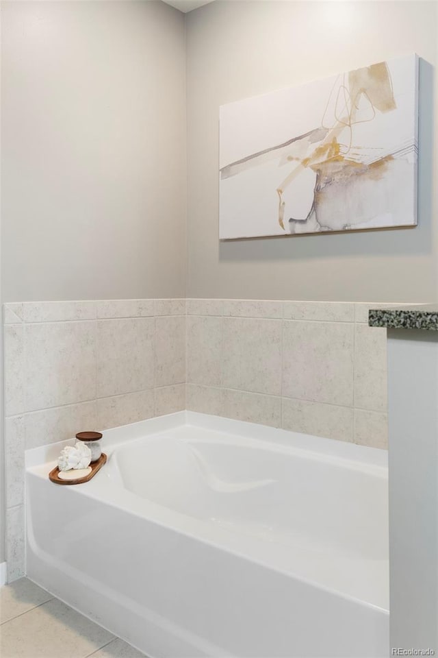 bathroom featuring tile patterned floors and a bathing tub