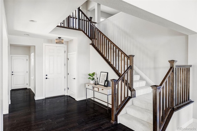 stairway featuring hardwood / wood-style floors