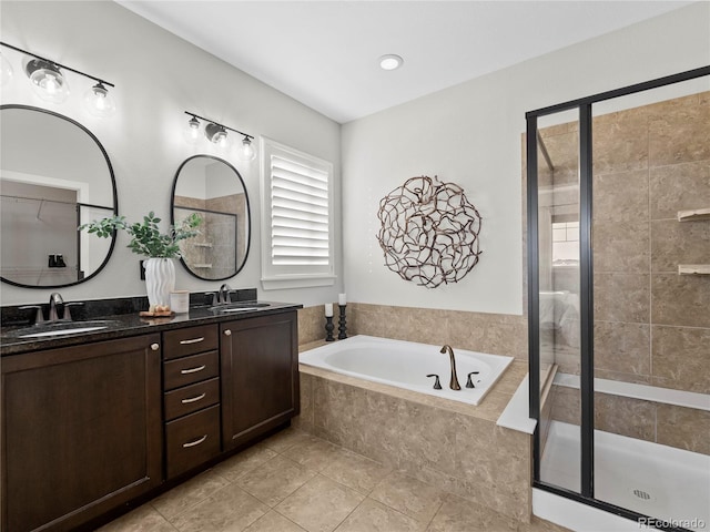 bathroom featuring vanity, separate shower and tub, and tile patterned floors