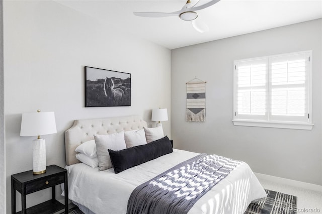 bedroom with ceiling fan and carpet