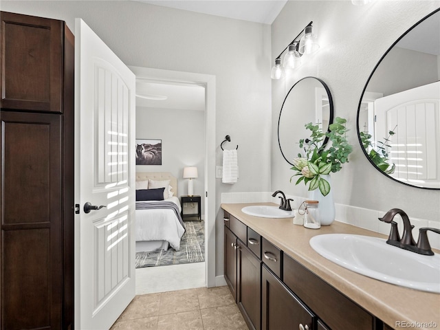 bathroom with tile patterned flooring and vanity