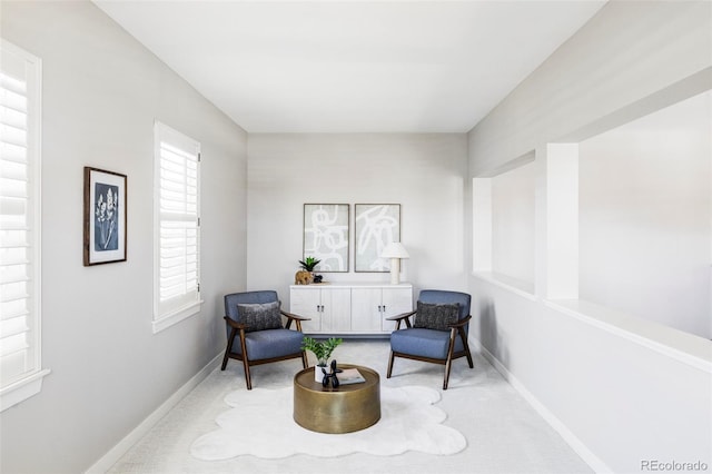 living area featuring light colored carpet