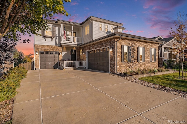 view of front facade featuring a garage and a balcony