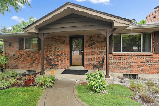 7077 Dudley Dr, Arvada, CO 80004 - property entrance with brick siding