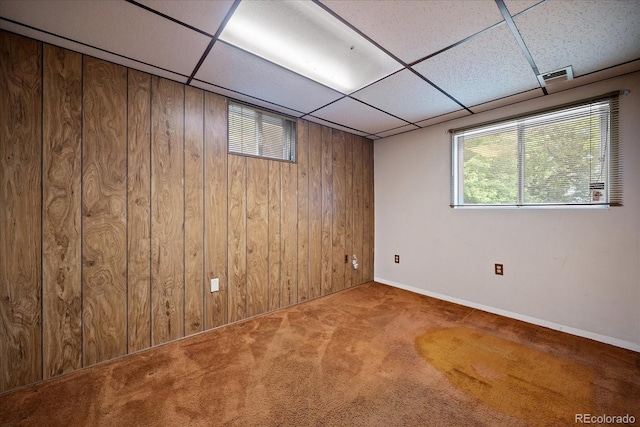7077 Dudley Dr, Arvada, CO 80004 - basement with carpet flooring, wood walls, and a paneled ceiling
