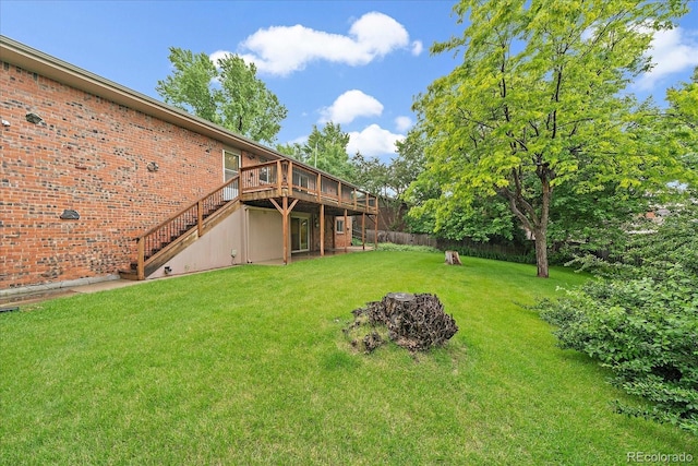 7077 Dudley Dr, Arvada, CO 80004 - view of yard featuring a deck, stairway, and a fire pit