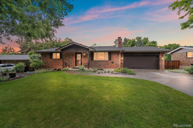 7077 Dudley Dr, Arvada, CO 80004 - ranch-style home with concrete driveway, an attached garage, brick siding, and a chimney
