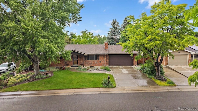 7077 Dudley Dr, Arvada, CO 80004 - single story home featuring brick siding, driveway, an attached garage, a front yard, and a chimney