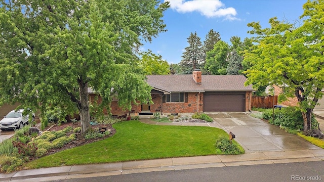 7077 Dudley Dr, Arvada, CO 80004 - view of front of home featuring brick siding, an attached garage, concrete driveway, and a chimney