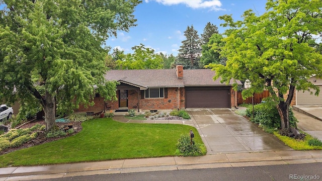 7077 Dudley Dr, Arvada, CO 80004 - ranch-style home with brick siding, an attached garage, driveway, and a front lawn