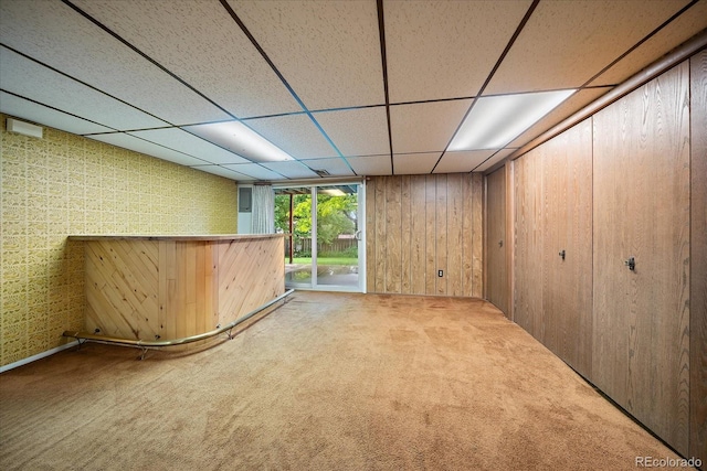 7077 Dudley Dr, Arvada, CO 80004 - indoor dry bar with carpet floors, a drop ceiling, and wooden walls