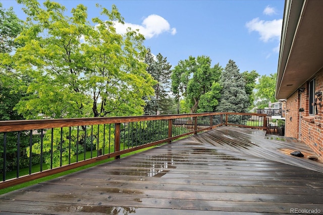 7077 Dudley Dr, Arvada, CO 80004 - deck with view of wooded area