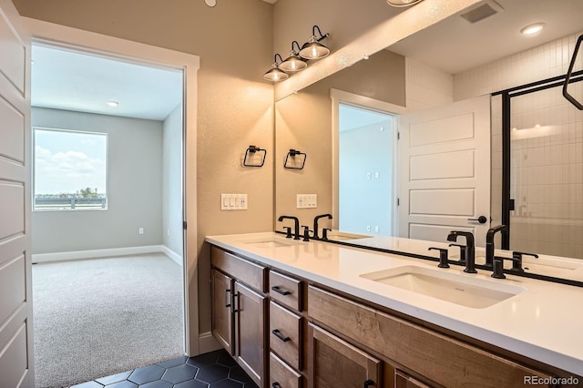 2491 W 69th Pl, Denver, CO 80221 - full bathroom featuring double vanity, tile patterned floors, and a tile shower