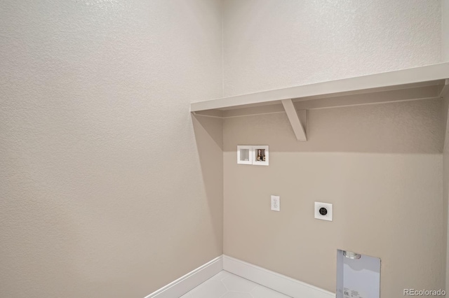 2491 W 69th Pl, Denver, CO 80221 - laundry area with washer hookup, hookup for an electric dryer, and light tile patterned floors