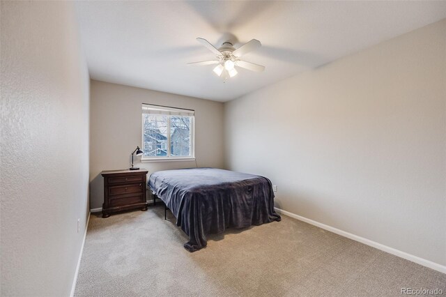 bedroom with light colored carpet and ceiling fan