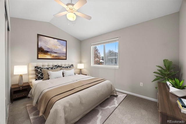 carpeted bedroom featuring ceiling fan and vaulted ceiling