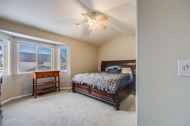 carpeted bedroom featuring ceiling fan and vaulted ceiling