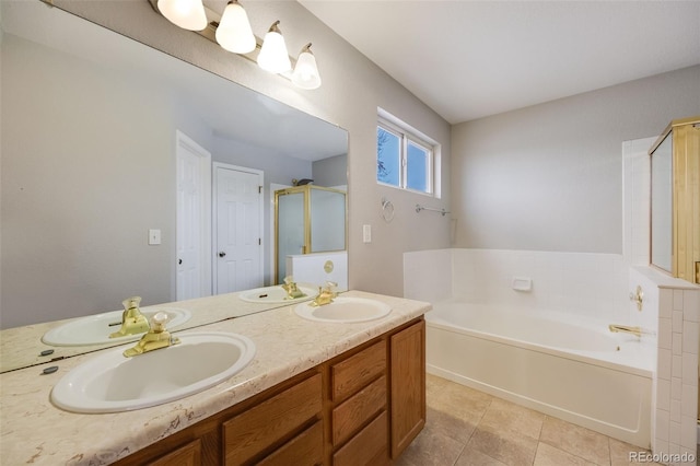 bathroom with tile patterned floors, vanity, and shower with separate bathtub