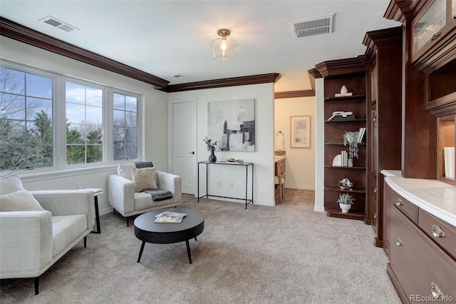 sitting room with crown molding, baseboards, light colored carpet, and visible vents