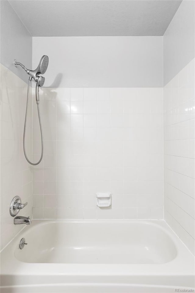 7680 Elmwood St, Littleton, CO 80125 - bathroom featuring shower / bathtub combination