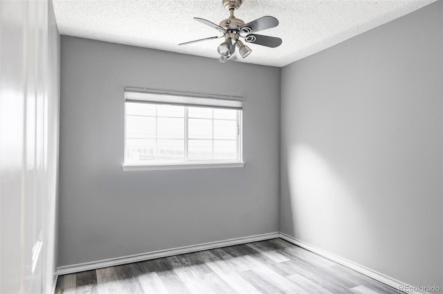 7680 Elmwood St, Littleton, CO 80125 - unfurnished room with a textured ceiling, wood finished floors, and ceiling fan