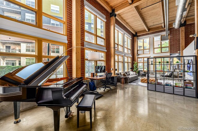 2955 Inca St Unit 1H, Denver, CO 80202 - misc room with a high ceiling, concrete flooring, and plenty of natural light