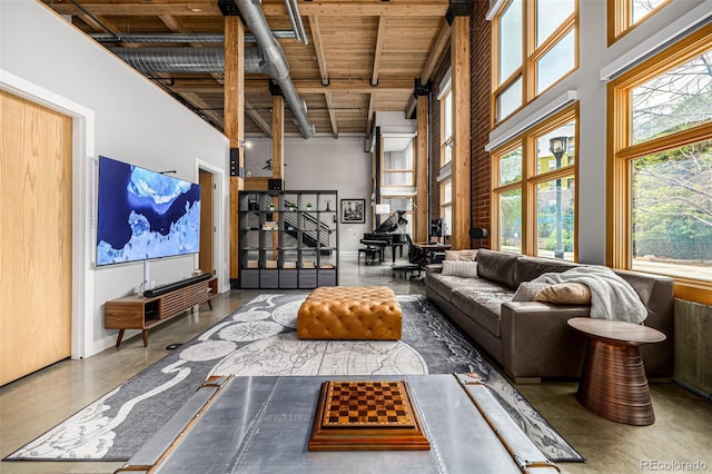 2955 Inca St Unit 1H, Denver, CO 80202 - living area with a high ceiling, stairway, a wood ceiling with exposed beams, and finished concrete flooring