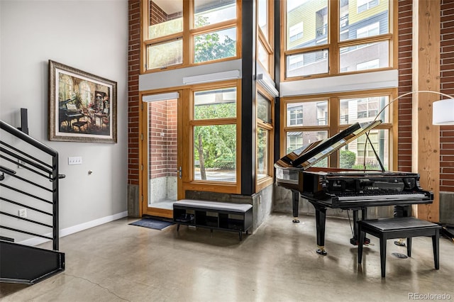 2955 Inca St Unit 1H, Denver, CO 80202 - entrance foyer featuring a high ceiling, healthy amount of natural light, concrete floors, and stairs
