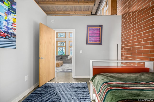 2955 Inca St Unit 1H, Denver, CO 80202 - bedroom with a wooden ceiling with exposed beams and baseboards