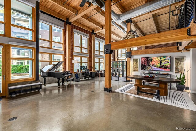 2955 Inca St Unit 1H, Denver, CO 80202 - interior space with high vaulted ceiling, a wooden ceiling with exposed beams, healthy amount of natural light, and finished concrete flooring