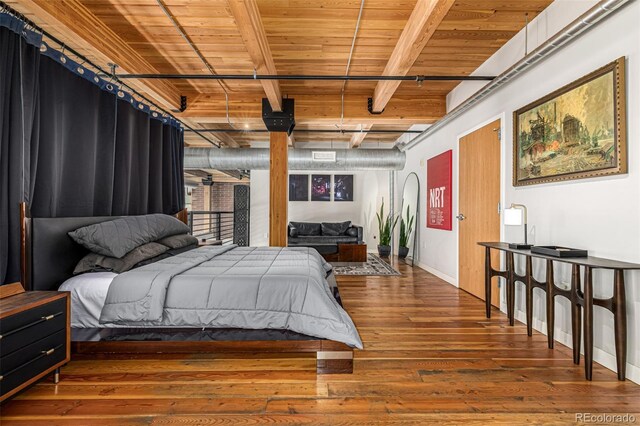 2955 Inca St Unit 1H, Denver, CO 80202 - bedroom featuring a wood ceiling with exposed beams and hardwood / wood-style floors