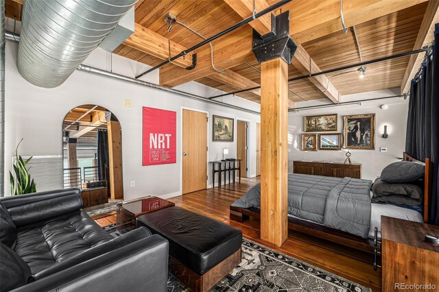 2955 Inca St Unit 1H, Denver, CO 80202 - living area featuring a wood ceiling with exposed beams, arched walkways, and wood finished floors